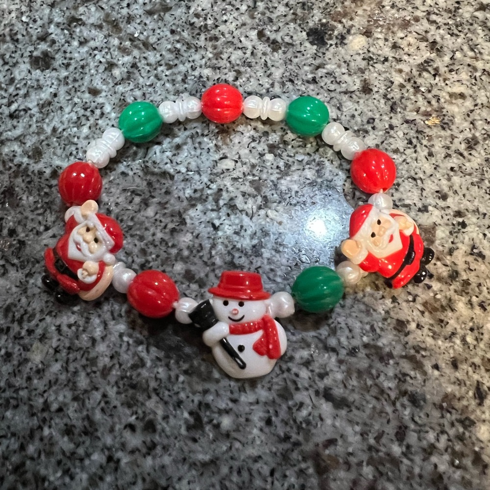 Cute Christmas Santa bracelet. Elastic inside. Wrist size up to 8”.